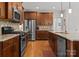 Modern kitchen featuring stainless steel appliances, granite countertops, and a large center island at 2606 Walker Rd, Matthews, NC 28105