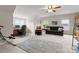 Spacious living room features comfortable seating, a ceiling fan, and natural light at 2606 Walker Rd, Matthews, NC 28105