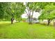 Backyard with lush greenery, trees, and well-maintained lawn at 275 N Garrison Rd, Rock Hill, SC 29730