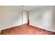 A bright bedroom features hardwood floors and white trim and paneling at 275 N Garrison Rd, Rock Hill, SC 29730
