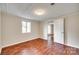 A bright bedroom features hardwood floors and white trim and paneling at 275 N Garrison Rd, Rock Hill, SC 29730