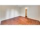 A bright bedroom features hardwood floors and white trim and paneling at 275 N Garrison Rd, Rock Hill, SC 29730