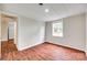 A bright bedroom features hardwood floors and white trim and paneling at 275 N Garrison Rd, Rock Hill, SC 29730