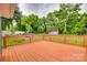 Spacious wooden deck with railings overlooks the backyard and greenery at 275 N Garrison Rd, Rock Hill, SC 29730