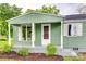 Close-up of the cozy covered porch with white pillars, freshly landscaped front at 275 N Garrison Rd, Rock Hill, SC 29730