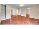 View of the hallway with hardwood floors and multiple doorways leading to other rooms at 275 N Garrison Rd, Rock Hill, SC 29730