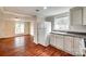 Well-lit kitchen features white cabinetry, granite countertops, and modern appliances at 275 N Garrison Rd, Rock Hill, SC 29730