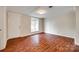 Bright living room featuring pristine walls, hardwood floors, and a large window at 275 N Garrison Rd, Rock Hill, SC 29730