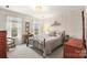 Bright bedroom with large windows, neutral decor, and a comfortable bed frame at 3115 Duck Point Dr, Monroe, NC 28110