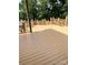Large, stained deck shows decorative railings and a view of the nearby water at 3115 Duck Point Dr, Monroe, NC 28110