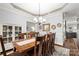 Bright dining room with hardwood floors, tray ceiling, and decorative details at 3115 Duck Point Dr, Monroe, NC 28110