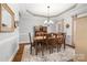 Elegant dining room with hardwood floors, tray ceiling, and natural light throughout at 3115 Duck Point Dr, Monroe, NC 28110