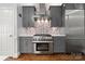 Gourmet kitchen with stainless steel appliances, custom backsplash, and plenty of storage space at 3115 Duck Point Dr, Monroe, NC 28110