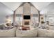 This formal living room has soaring ceilings, a brick fireplace, and ample natural light at 3115 Duck Point Dr, Monroe, NC 28110