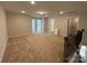 Spacious bonus room with neutral walls, carpet, and multiple entry doors, perfect for various uses at 4131 Black Ct # 170, Harrisburg, NC 28075