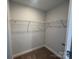 Walk-in closet with wire shelving, carpet, and neutral paint, providing ample storage space at 4131 Black Ct # 170, Harrisburg, NC 28075