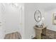 Bright entryway with wood floors, a decorative mirror, and a stylish table at 4226 Randolph Rd, Charlotte, NC 28211