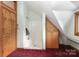 Bathroom with red carpet featuring a shower and wood cabinets at 443 Troutman Farm Rd, Statesville, NC 28677