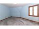 Comfortable bedroom with blue walls, a window, and plush carpeting, creating a tranquil atmosphere at 443 Troutman Farm Rd, Statesville, NC 28677