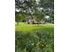 Charming dome home with a well-maintained lawn, flower beds and deck in a serene, wooded setting at 443 Troutman Farm Rd, Statesville, NC 28677