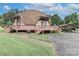 Unique dome home with wrap-around deck, carport, and stone pathway set on a beautiful lot at 443 Troutman Farm Rd, Statesville, NC 28677