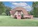 Quaint dome home with a welcoming front deck and charming curb appeal at 443 Troutman Farm Rd, Statesville, NC 28677