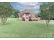 Unique dome home featuring a deck and a well-maintained lawn at 443 Troutman Farm Rd, Statesville, NC 28677