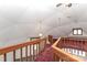 Hallway with red carpet, wooden railing, and a skylight at 443 Troutman Farm Rd, Statesville, NC 28677