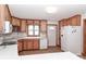 Well-lit kitchen featuring ample cabinet space, white appliances, and a convenient layout for cooking at 443 Troutman Farm Rd, Statesville, NC 28677