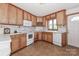 Functional kitchen with abundant cabinetry, white appliances, and a practical design for everyday use at 443 Troutman Farm Rd, Statesville, NC 28677
