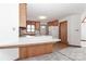 Bright kitchen with light wood cabinets, white countertops, and an inviting breakfast bar area at 443 Troutman Farm Rd, Statesville, NC 28677