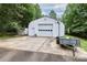 Quonset hut building with large garage door offers practical space and functionality at 443 Troutman Farm Rd, Statesville, NC 28677