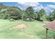 Large, grassy yard with mature trees and open space, offering privacy and a natural setting at 443 Troutman Farm Rd, Statesville, NC 28677