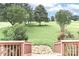 Serene yard view from a porch, showcasing lush landscaping, mature trees, and a long driveway at 443 Troutman Farm Rd, Statesville, NC 28677