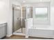 Bright bathroom featuring a glass enclosed shower and a soaking tub at 5254 Spanish Ivy Ln # 133, Indian Land, SC 29707