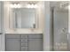 Bathroom featuring a double vanity and a shower at 5254 Spanish Ivy Ln # 133, Indian Land, SC 29707