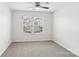 Bright bedroom featuring a ceiling fan and a window overlooking the neighborhood at 5254 Spanish Ivy Ln # 133, Indian Land, SC 29707
