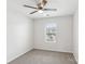 Bright bedroom featuring a ceiling fan and a window overlooking the neighborhood at 5254 Spanish Ivy Ln # 133, Indian Land, SC 29707