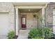 Welcoming covered porch with brick accents and stylish front door at 5254 Spanish Ivy Ln # 133, Indian Land, SC 29707