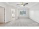 Spacious main bedroom suite featuring a ceiling fan and an ensuite bathroom at 5254 Spanish Ivy Ln # 133, Indian Land, SC 29707