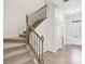 Carpeted staircase with decorative iron railing at 5254 Spanish Ivy Ln # 133, Indian Land, SC 29707