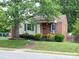Charming home featuring mixed siding, a brick foundation, and mature landscaping at 557 Melbourne Ct, Charlotte, NC 28209