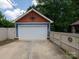 Detached two-car garage with unique rustic design and private entrance, adding charm to this home at 557 Melbourne Ct, Charlotte, NC 28209