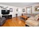 Bright living room with hardwood floors, neutral paint, and ample seating, perfect for entertaining at 557 Melbourne Ct, Charlotte, NC 28209