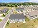 Aerial view of new townhomes featuring backyard patios, landscaping, and private entrances at 5625 Axil Ln, Charlotte, NC 28269