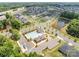 Panoramic aerial shot of a residential community with a pool, clubhouse, and neighborhood pond at 5625 Axil Ln, Charlotte, NC 28269