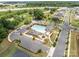Aerial view of community pool, pavilion, and parking with mature trees and roadways nearby at 5625 Axil Ln, Charlotte, NC 28269