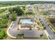 Aerial view of neighborhood pool and clubhouse with ample parking and green space at 5625 Axil Ln, Charlotte, NC 28269