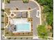 Overhead shot of community pool and clubhouse with lounge chairs and manicured landscaping at 5625 Axil Ln, Charlotte, NC 28269