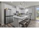 Well-lit kitchen featuring a central island, modern appliances, and stylish finishes at 5625 Axil Ln, Charlotte, NC 28269